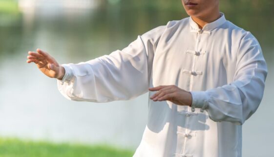 Asian man working out with Tai Chi in the morning at the park, C