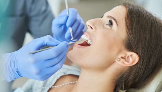 male-dentist-and-woman-in-dentist-office-2023-11-27-04-50-36-utc-2