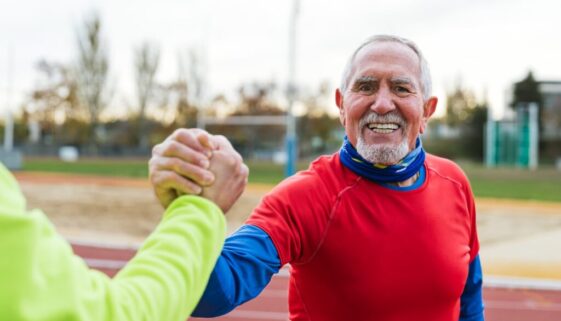 senior-athlete-celebrating-with-handshake-at-track-2025-03-10-02-10-41-utc-2