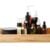 Set of cosmetic dark glass bottles on wooden stand