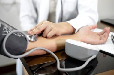 The female doctor measured blood pressure, the patient examined the heartbeat and sat down to talk about health care closely. health care concept.