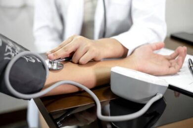 The female doctor measured blood pressure, the patient examined the heartbeat and sat down to talk about health care closely. health care concept.