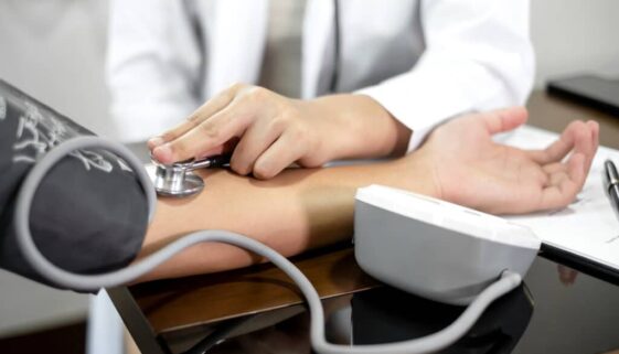 The female doctor measured blood pressure, the patient examined the heartbeat and sat down to talk about health care closely. health care concept.