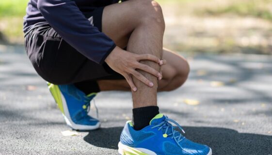 young-fitness-man-holding-his-sports-leg-injury-m-2026-03-24-04-49-51-utc-2