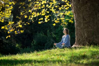 woman-meditating-in-a-park-by-a-tree-2026-03-09-03-25-04-utc-2